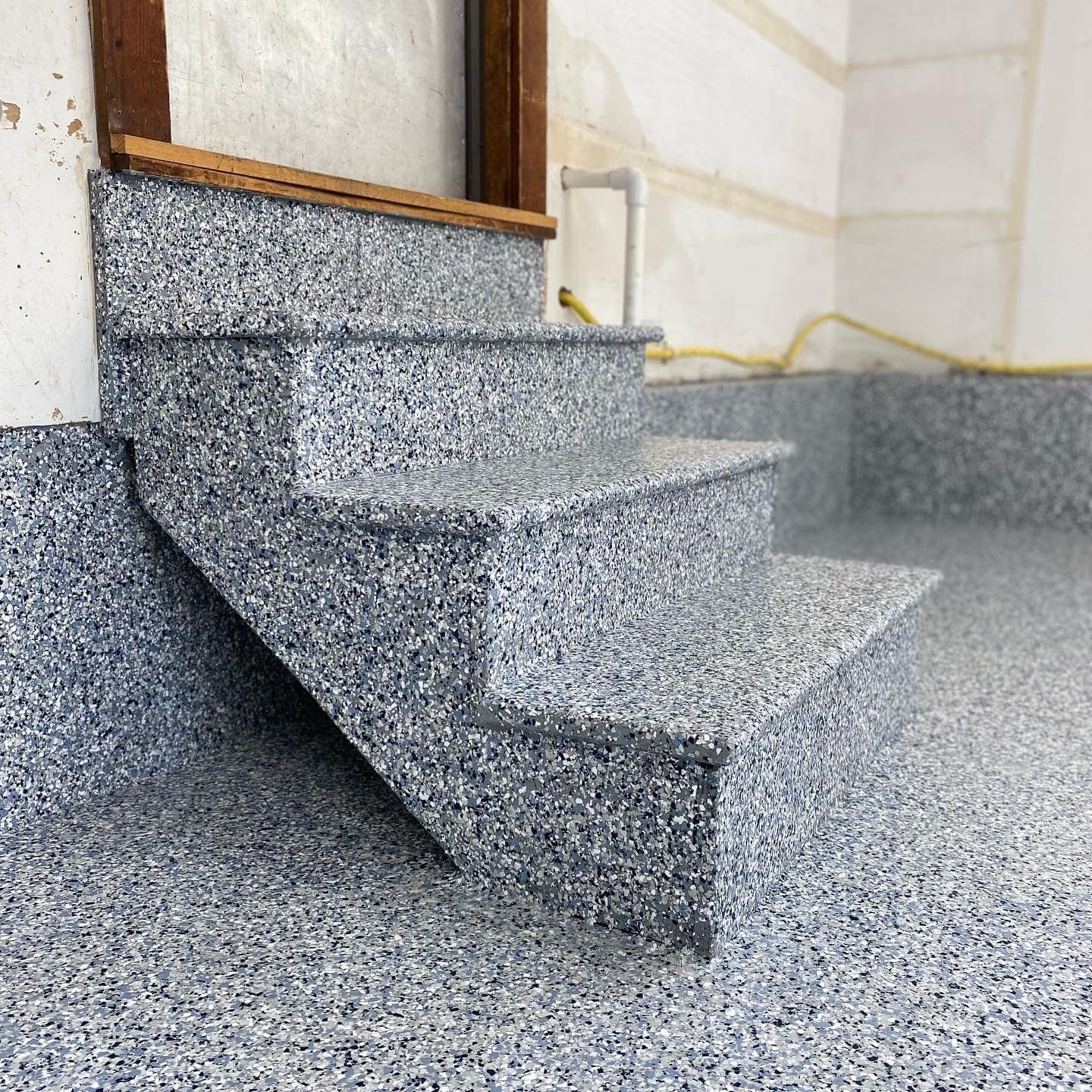 Concrete stairs coated with flake epoxy