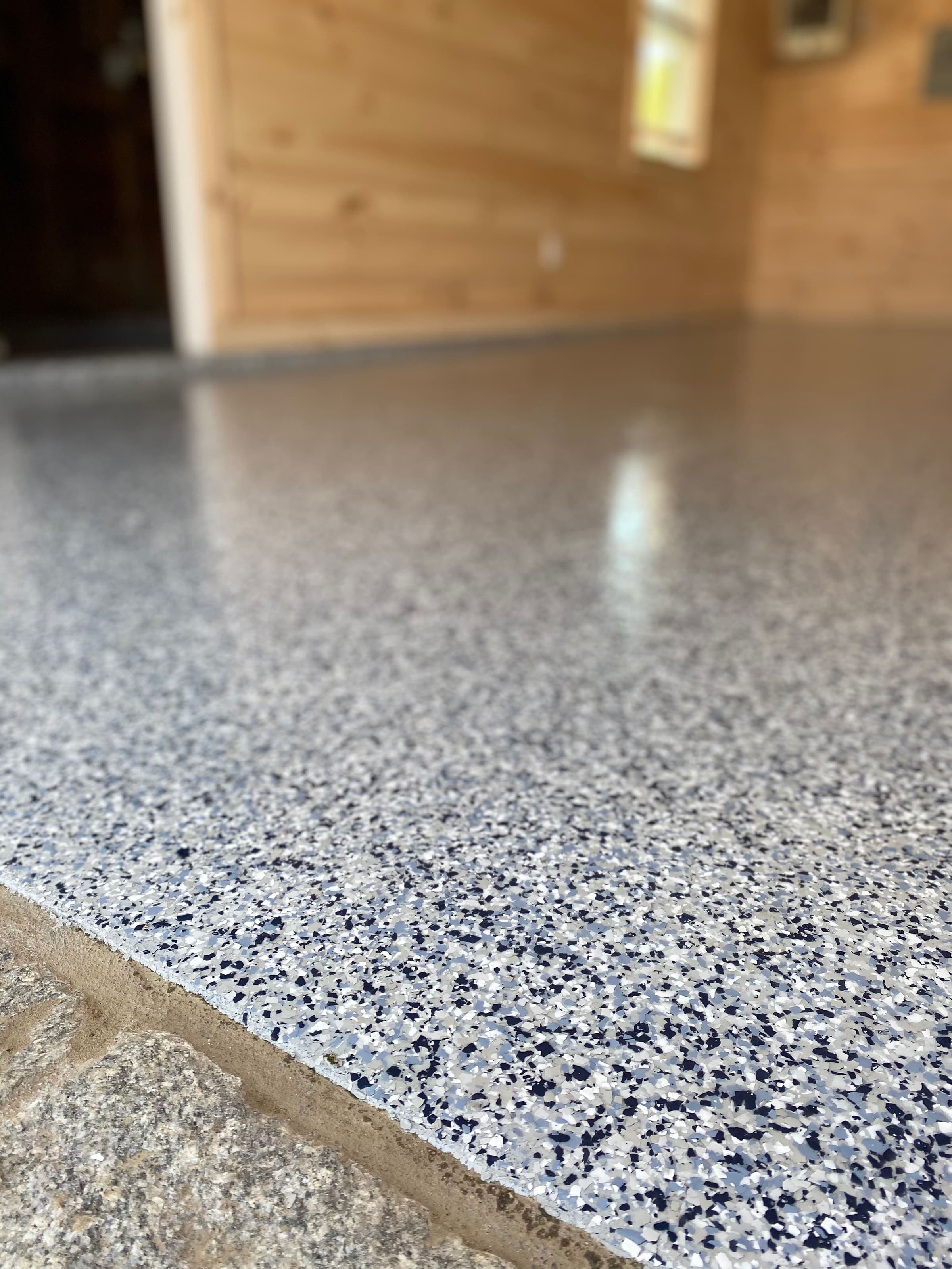 Flake epoxy meeting a granite ledge