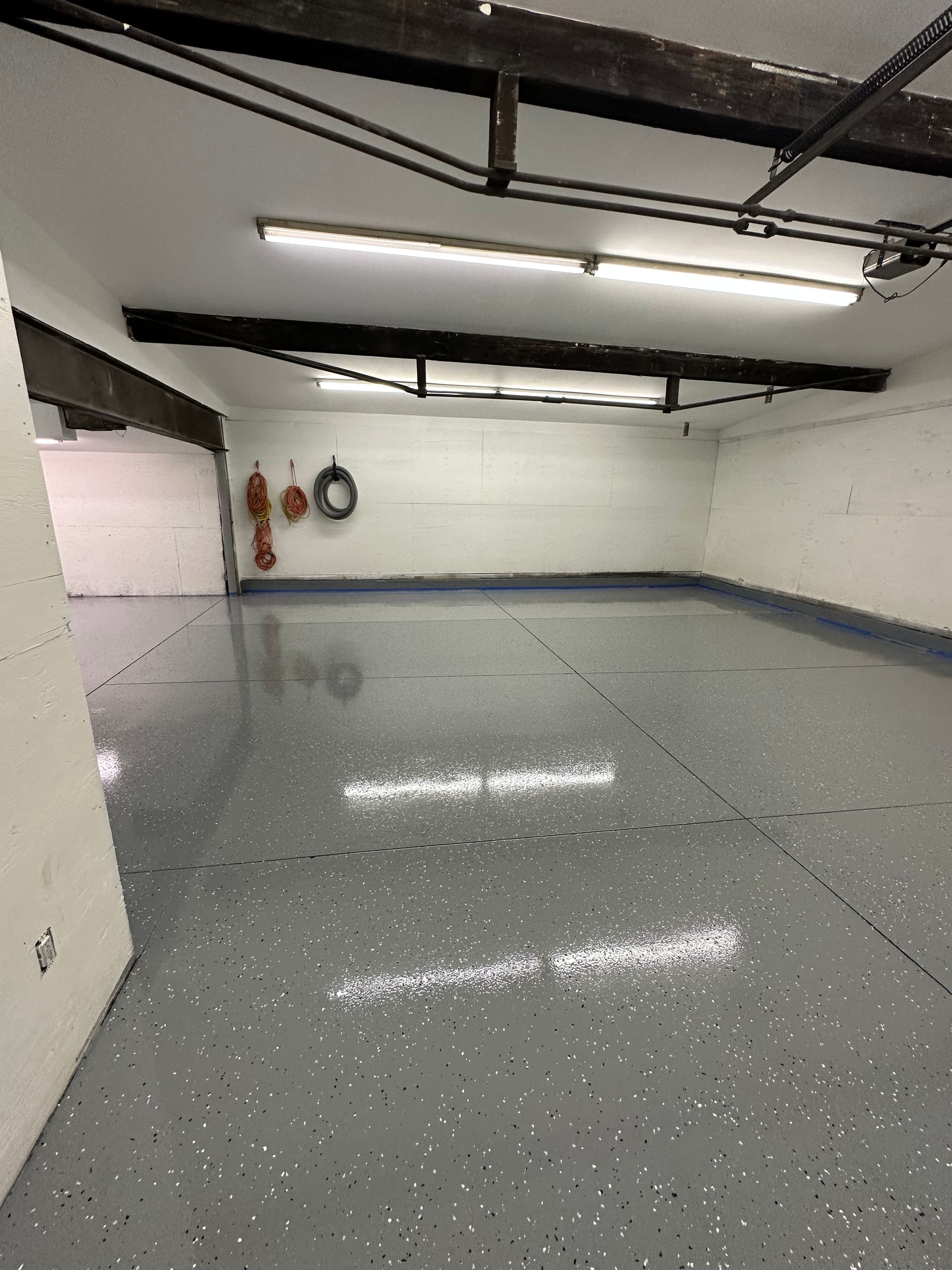Two-car garage with gray full-flake epoxy floor