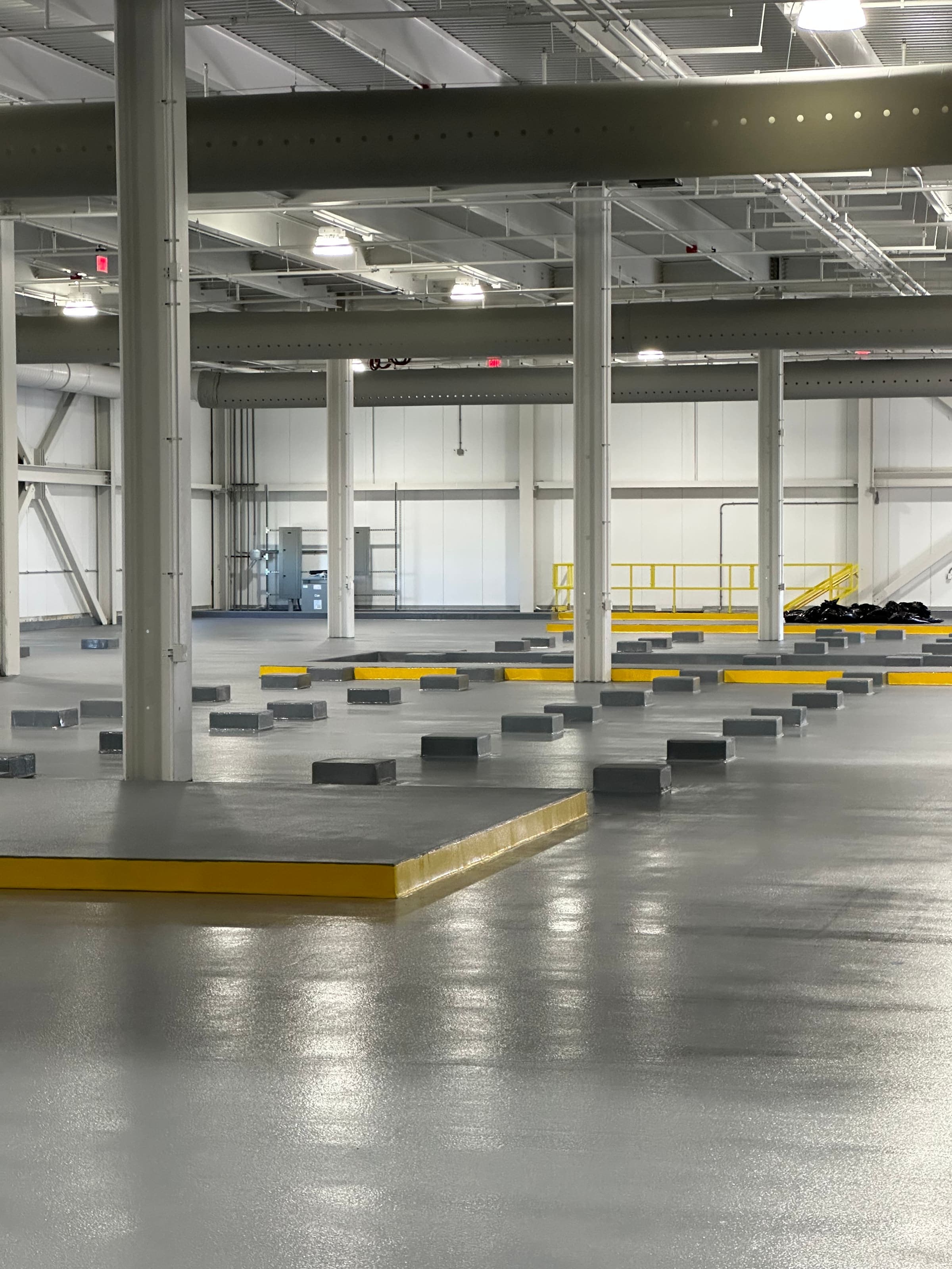 Warehouse interior with coated floor and columns